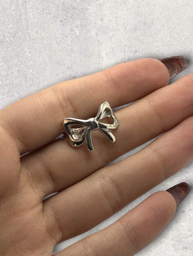 Anillo moño plata sales