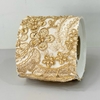 Capa de papel higiênico dourada com flores e pedraria