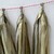 Pompones de flecos en papel seda dorados. 35 cms de largo. Paquete x 5 unidades - tienda online