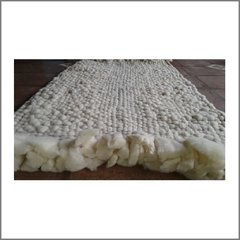 Alfombra de vellón y lana tejida en telar