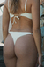 Zoom de bombacha colaless de bikinis color crema con tiras regulables.
