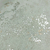Detalhe do Papel de Parede Cimento Queimado Cinza Mescla Bege com Brilho Metálico - Coleção White Swan Kantai 101603 | 10 metros | Cola Grátis - Ciça Braga