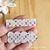 Placa Hair Clips LV branco colors