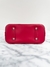 Bolsa Louis Vuitton Alma Epi Vermelha na internet