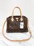 Bolsa Louis Vuitton Rivoli MM Monograma - MICROCHIPPED