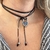 Choker Forever com cordão de seda preto encerado com pingente em formato de coração no banho de ródio branco gravado com a mensagem "Forever In My Heart".