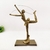 Enfeite Estátua Mulher Ginasta Corda Dourada 31x20x9cm - comprar online