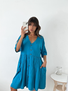 Vestido amplio fibrana escote V con frunce y bolsillos tiene cartera con botones Rodas