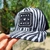 Boné Trucker Zebra com estampa em preto e branco e logo "MADE IN MATO".