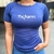 Camiseta feminina azul marinho da marca Texas Farm, com logo tx.farm em destaque.