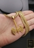 Corrente Grumet Escamas 70cm 7mm Fecho Tradicional Banhado a Ouro 18K + Pingente Machado Vikings na internet