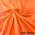 Tecido Musseline Lisa Laranja Neon - Ideal para a confecção de vestidos de Festa com saias fluidas, esvoaçantes e de Caimento Delicado, o Tecido Musseline Lisa é também muito utilizado para criar sobreposições, drapeados e camadas.