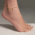 tornozeleira rommanel folheado a ouro fio grumet formada por 3 pingentes estrela do mar - 551668 - comprar online