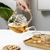 Tetera de vidrio con asa de madera de bamboo 1.2L. en internet