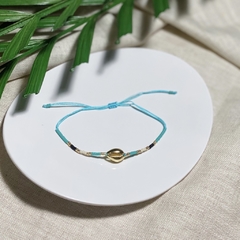 PULSEIRA BÚZIO VERDE REGULÁVEL BANHADO A OURO. - comprar online