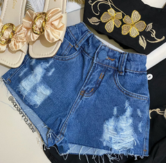 Short jeans bolso bordado