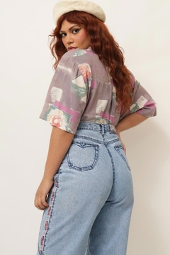 Calça jeans cintura alta detalhe escrita lateral - loja online