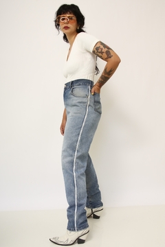 Calça jeans cintura mega alta VALENTINO na internet