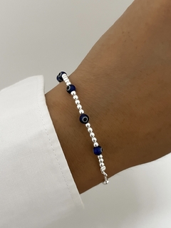 Pulsera bolitas y ojitos azules - Estilojoyasmanu