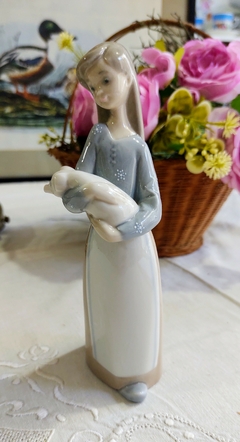 Figura de porcelana Lladro España Niña con chanchito