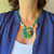 Leather and glass green necklace.