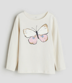 Remera H&M - Cruda, manga larga, con mariposa, detalles con brillitos