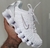 Imagem do Nike 12 Molas Branco/ Prata