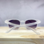O Óculos de Sol Fire Cristal Fosco possui um design urbano, em formato hexagonal, feito 100% em acetato cristal fosco com lentes degradê na cor roxa. 