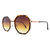 O Óculos de Sol Fine Tartaruga possui um design moderno, em formato geométrico, armação em metal rosê com detalhes ao redor das lentes em acetato estampado e lentes degradê na cor Marrom.