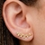 Par de brincos ear cuff com zircônias na cor cristal folheados em ouro 18k da Anastásia Joias