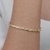 Pulseira bracelete rígido de escamas com detalhes de zircônias cristal folheada em Ouro 18k