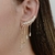 Brinco Ear Cuff delicado com pedras de zircônia cristal folheado em Ouro 18k