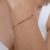 Pulseira feminina delicada com bolinhas lisas achatadas folheada em ouro 18k - comprar online