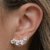 Brinco Ear Cuff com a base cravejada e 4 pedras de zircônia to de gotas cor cristal folheado em ouro 18k - comprar online