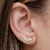 Brinco Ear Cuff com navetes pequeno e zircônias redondas cor cristal folheado em Ouro 18k
