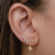 Brinco Ear Cuff com pedras de zircônias e pingente estrela de 8 pontas cravejado folheado em ouro 18k