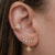 Brinco Ear Cuff com pedras de zircônias e pingente estrela de 8 pontas cravejado folheado em ouro 18k - comprar online