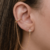 Brinco Ear Cuff de estrela 4 pontas com piercing fake de pressão cravejado Banhado em Ouro 18 k - comprar online