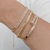 Bracelete rígido com fecho de encaixe em formato de prego com pedras de zircônias cor cristal Banhado em ouro 18k - comprar online