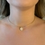 Colar Choker Aro Rígido com Pingente Ônix Banhado em Ouro 18k na internet