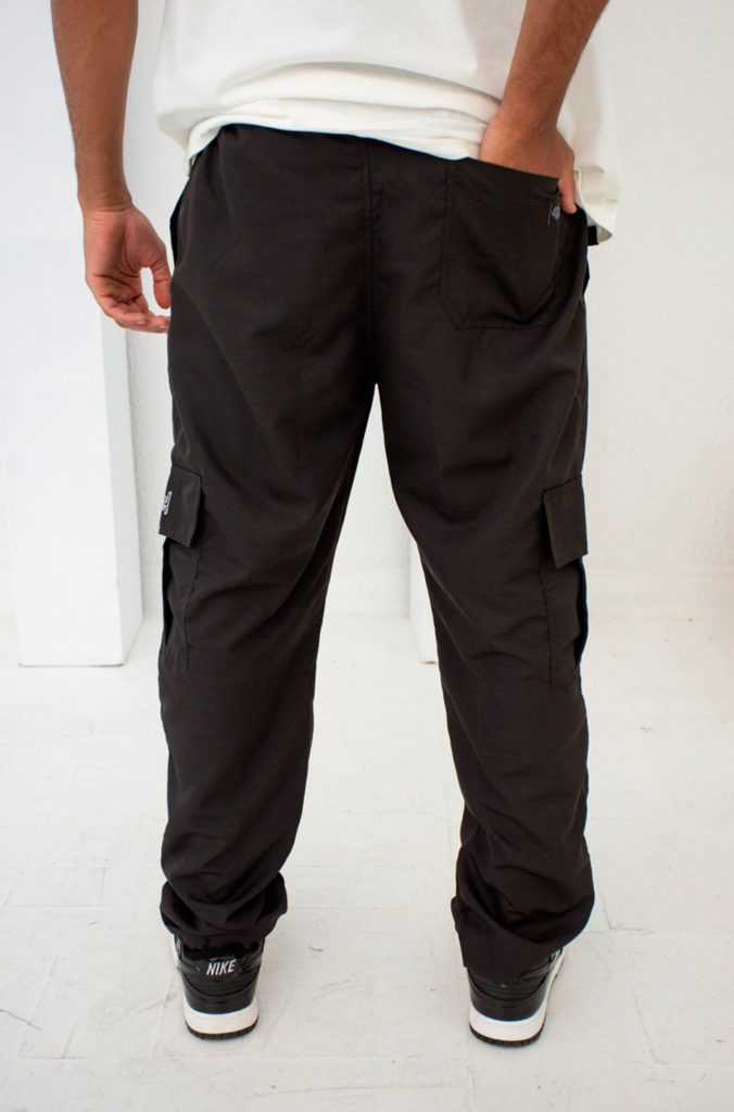 Articulo Calça de trabalho ripstop. Algodão/poliéster/elastano 280 g/m².  Preto e cinza.