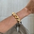 Bracelete Oval Largo Ondas Dourado - comprar online