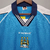 camisa-manchester-city-1999-2001-casa-le-coq-sportif-azul-retro