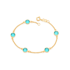 Pulsera laminada en oro 18k con piedras agua marina.