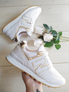 ZAPA NEW BALANCE BLANCA CON DORADO - Co.markaarg