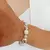 PULSERA CON PERLAS Y SW - comprar online