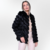  Coat made of natural rabbit fur and Chevron Stripes V diagonal Pelica leather with collar and pocket. Warm women's neck for the cold autumn and winter. Sophisticated and casual. Fabiane Frank Fur and Shop 2024 2025 outlet black front