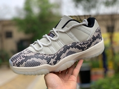 Air Jordan 11 Retro Low "Light Bone Snakeskin" na internet