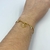 Pulseira Folheado a ouro - Coração vazado entre Meio Mini coração (Amor) + 2 Strass pendurado na internet