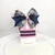 Conjunto infantil laço + kit de pulseiras - Laço azul escuro e rosa com floral e transparente na internet